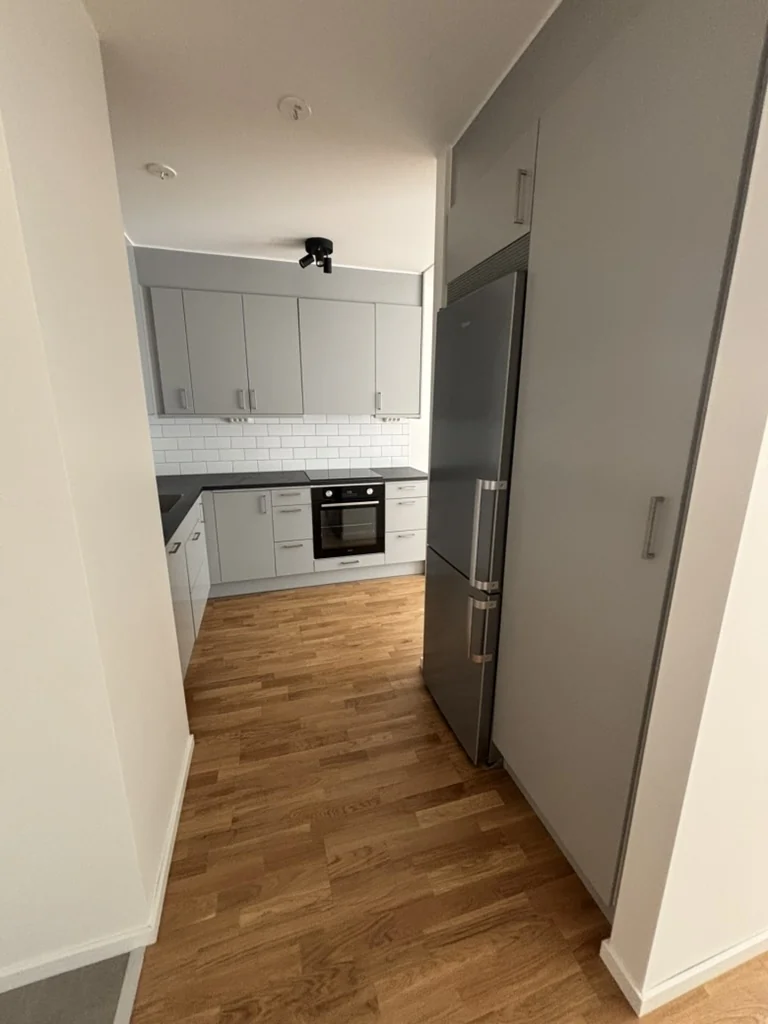 Clean grey kitchen after moving cleaning by Sweepit